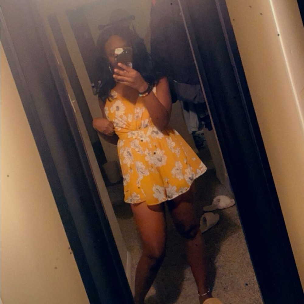 Yellow Romper sized extra small, floral print. Good condition
